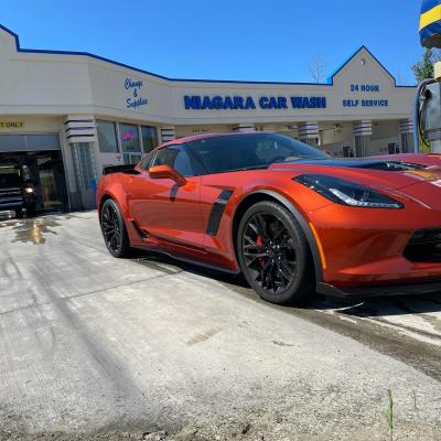 Car owner experiencing the benefits of a touchless car wash in Erie, PA